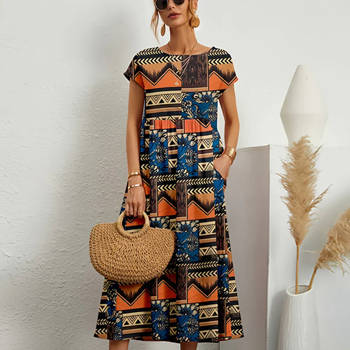 Chic women's relaxed midi dress. Cap sleeve, round neck. Versatile casual dress for spring & summer.