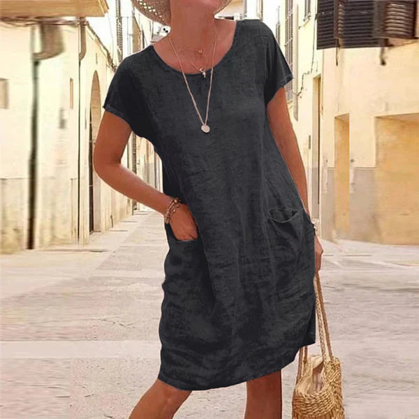 Women's casual short sleeve midi dress with pockets. Perfect for everyday wear, a relaxed fit summer dress.
