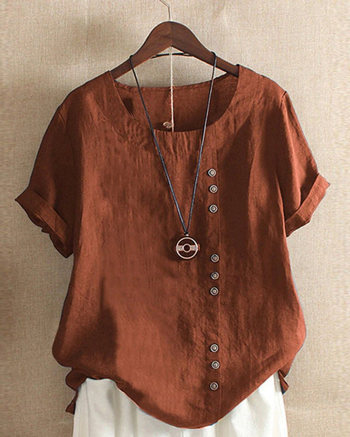 Soft women's casual button-front shirt with short sleeves and a curved hem, great for daily spring & summer fashion.