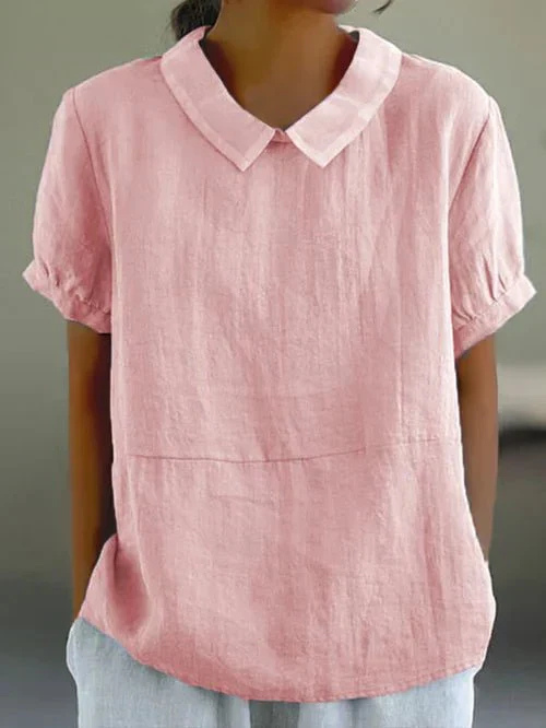 Relaxed fit women's Peter Pan collar short-sleeve top. Perfect casual blouse for effortless spring and summer fashion.