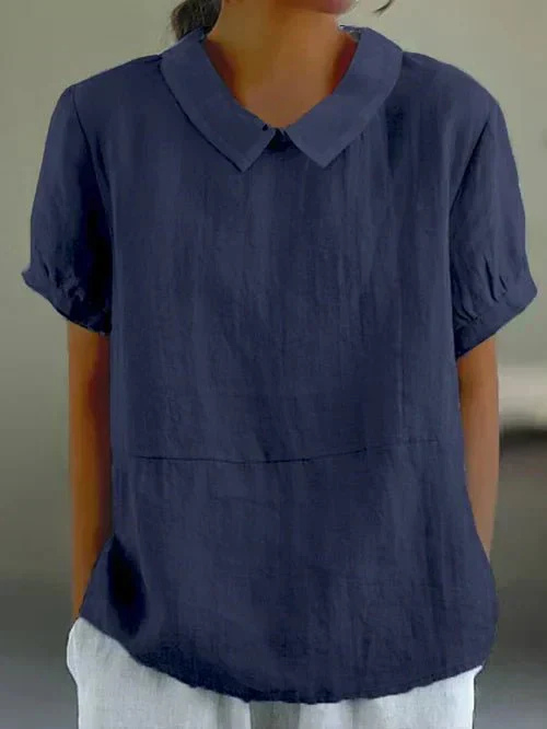 Charming women's casual short-sleeve top with elegant Peter Pan collar. Versatile, comfortable for everyday spring wear.
