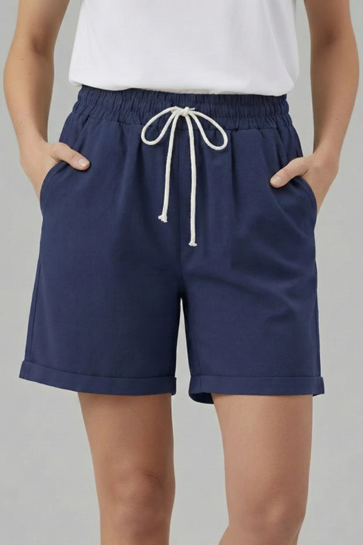 Soft women's casual shorts with elastic waist, drawstring, cuffed hem, & pockets. Perfect for summer style.