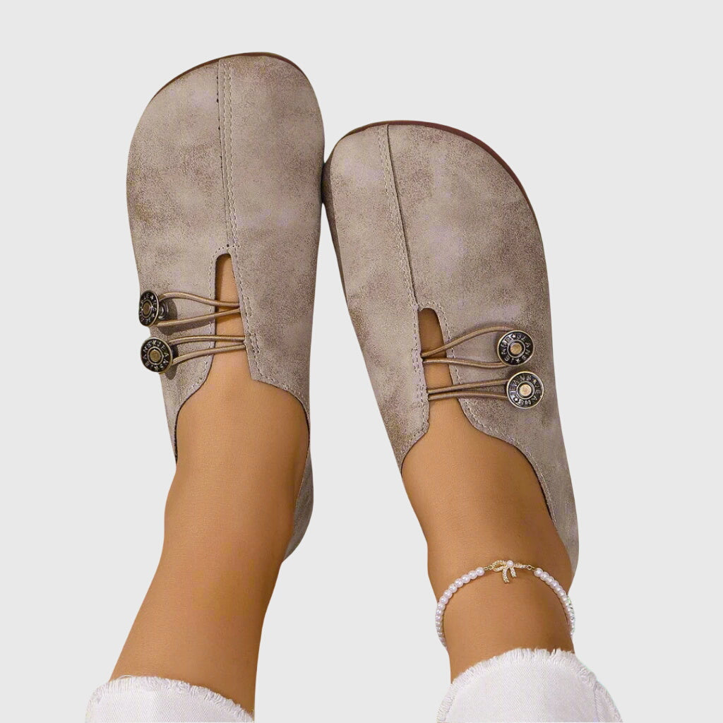 Lightweight slip-on women's flats with unique button detail, ideal for comfortable casual wear