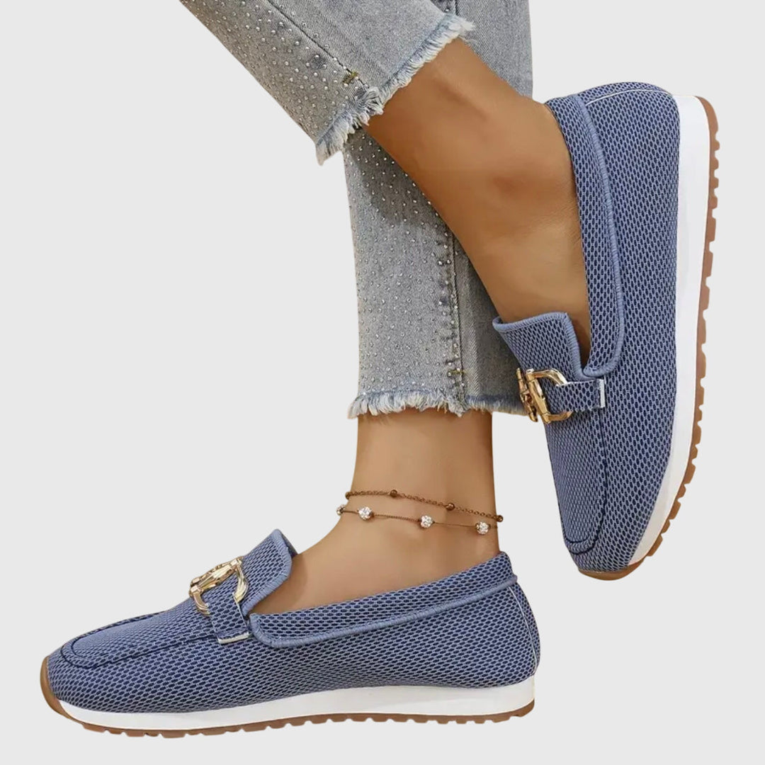 Elegant women's flat loafers in a breathable fabric, designed for spring and summer comfort.