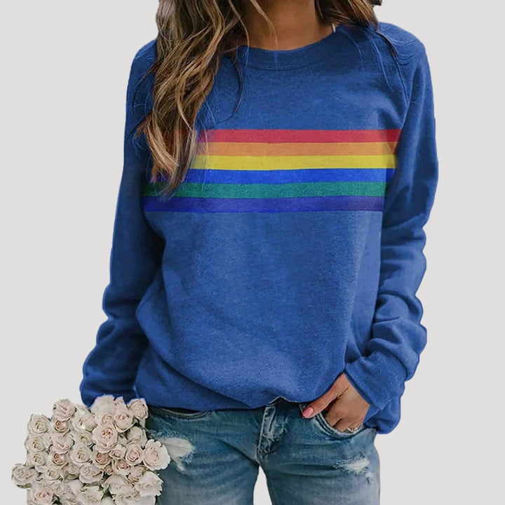 Soft knit women's pullover sweatshirt featuring a colorful rainbow stripe design, ideal for spring