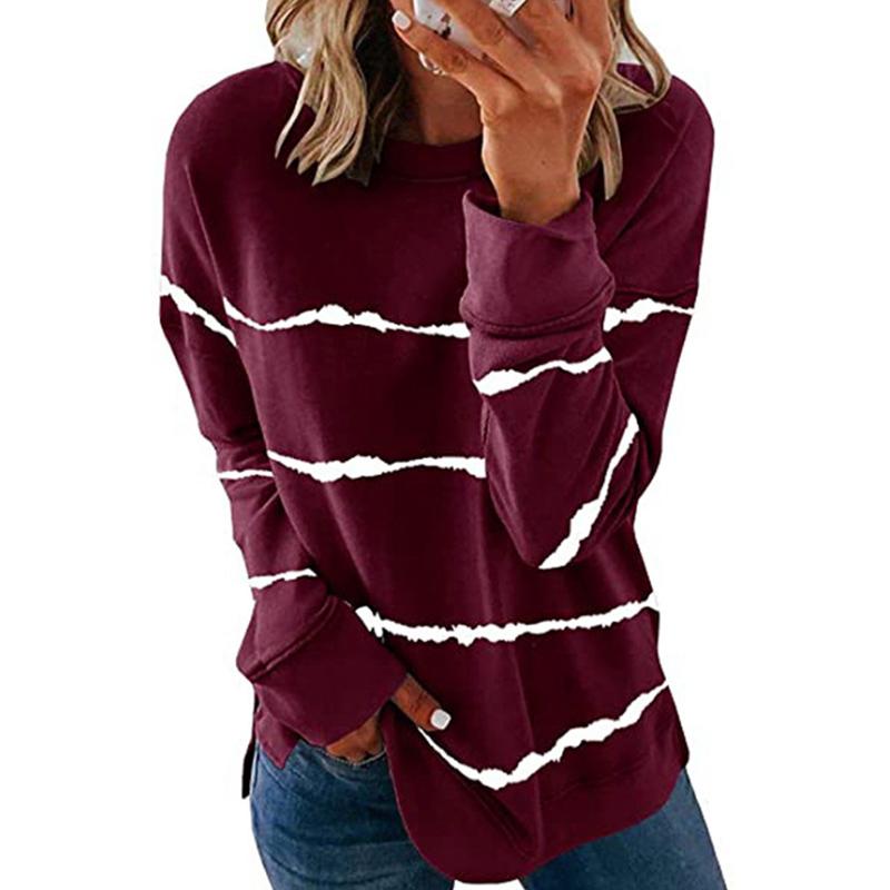 Side view of women's casual striped long sleeve pullover, emphasizing comfortable silhouette