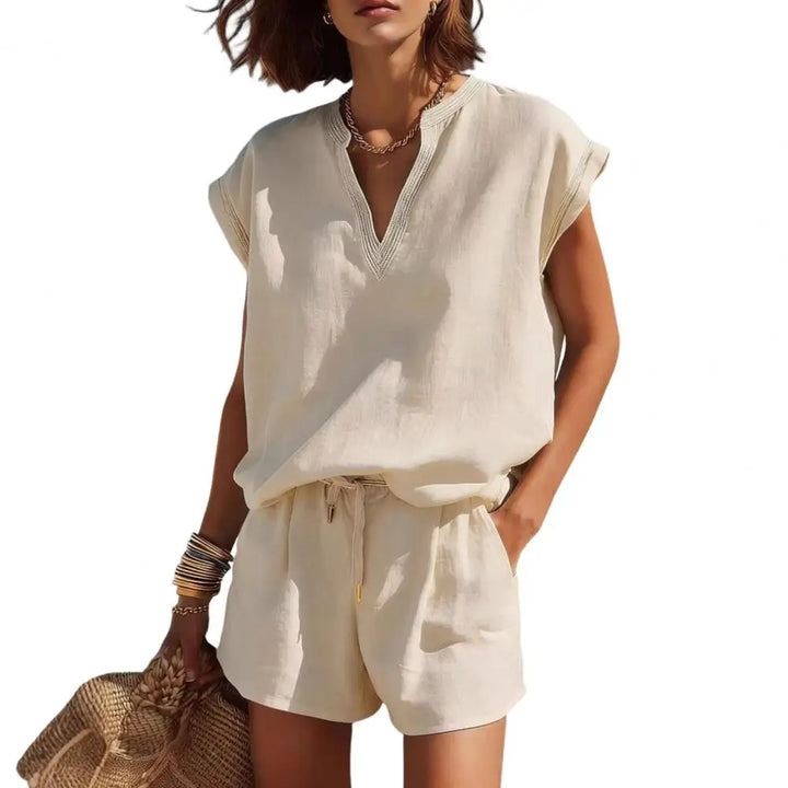 Chic women's casual two-piece summer set: notch V-neck top & drawstring shorts. Versatile resort wear.