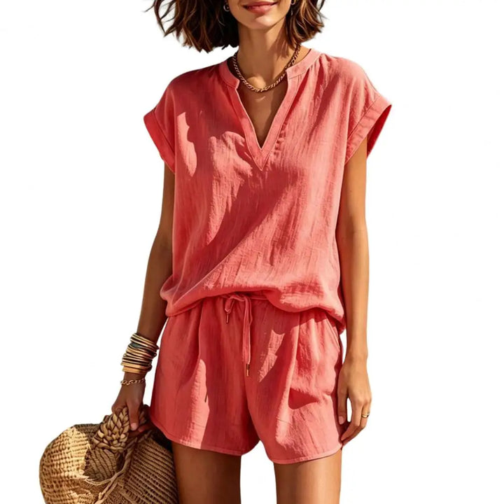 Women's linen-look casual summer outfit: V-neck top & drawstring shorts. Essential for vacation fashion.