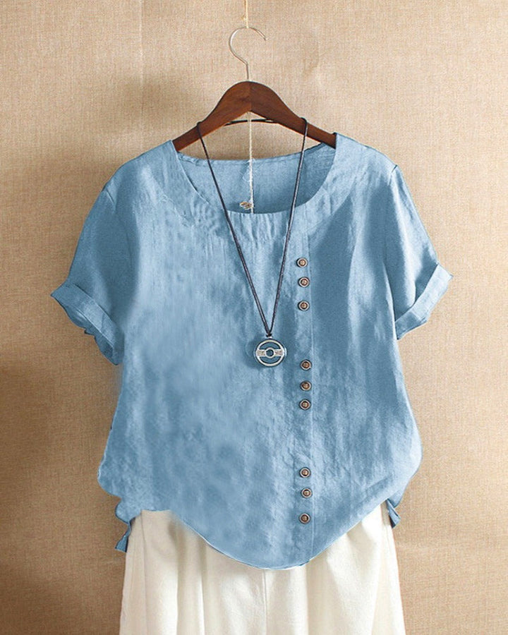 Women's short sleeve tunic blouse, relaxed fit, versatile casual top for summer.