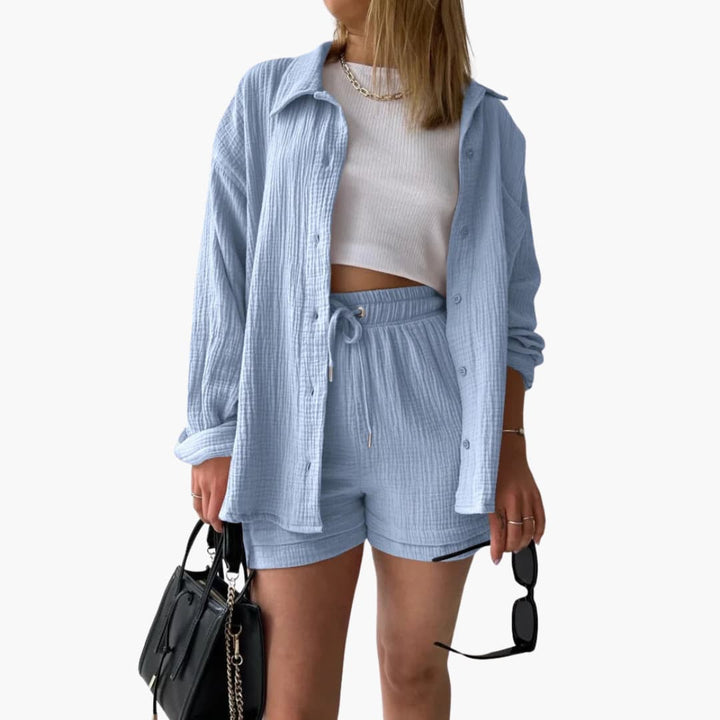 Woman in relaxed fit two-piece set, enjoying outdoor summer day, comfortable.