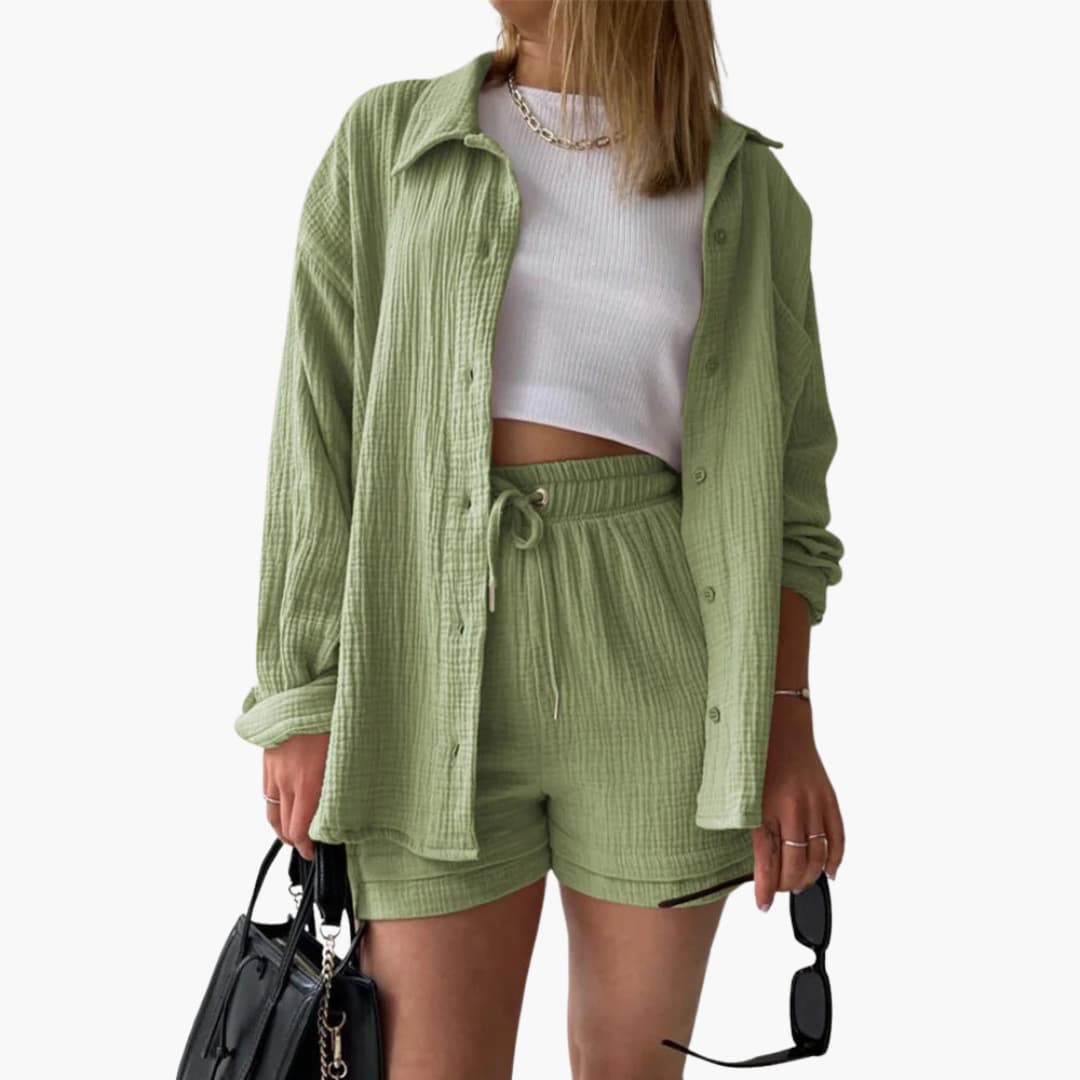 Woman posing in vibrant casual two-piece set, lightweight & stylish.