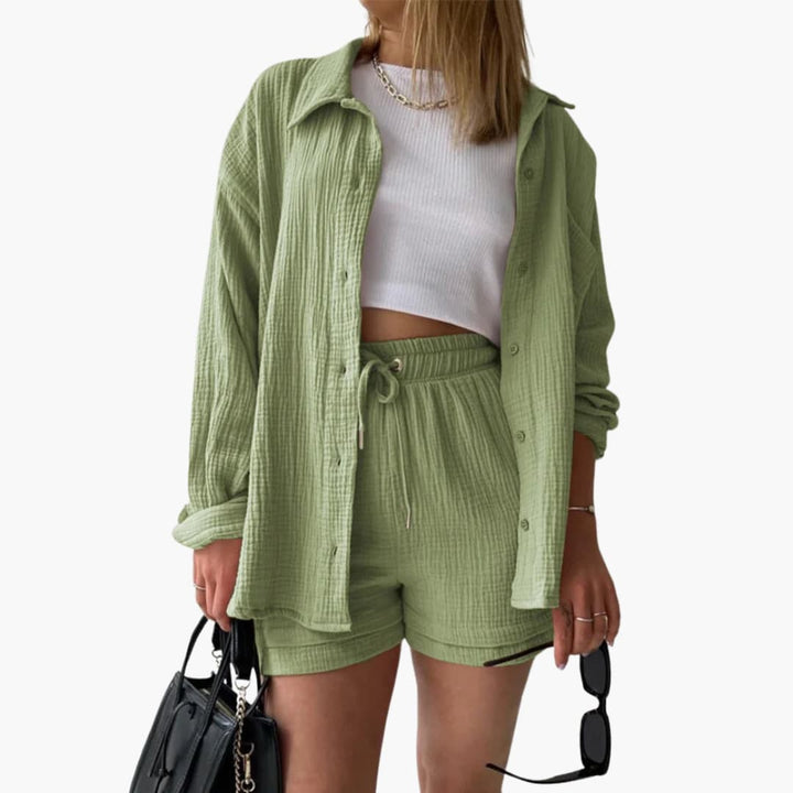 Woman posing in vibrant casual two-piece set, lightweight & stylish.