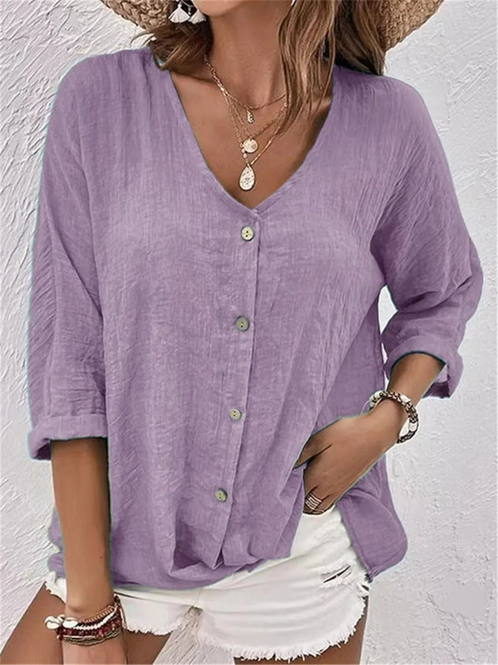 Stylish ladies V-neck button-front top, perfect for casual spring/summer fashion. Three-quarter sleeves for comfort.