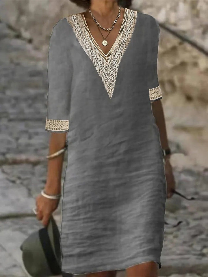 Women's casual V-neck dress with delicate lace trim, 3/4 sleeves, and a relaxed fit for comfortable everyday wear.