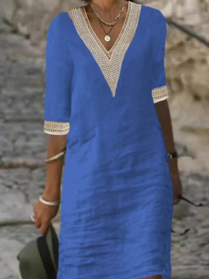 Comfortable women's casual dress featuring a flattering V-neck, pretty lace trim, and practical 3/4 sleeves. Spring style.