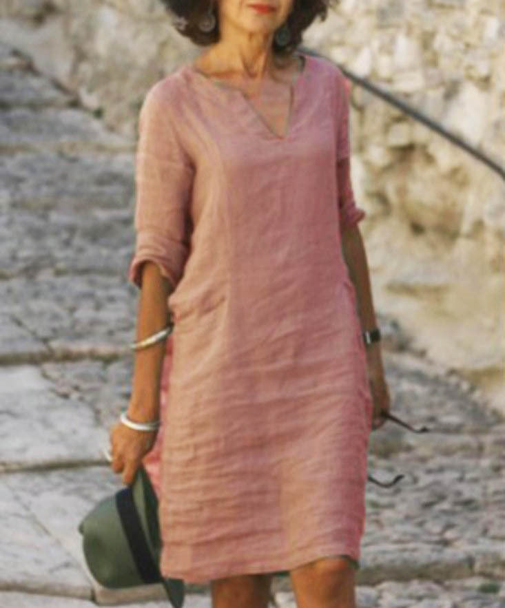 Women's V-neck midi dress with comfortable 3/4 sleeves, perfect for casual summer style & vacation.