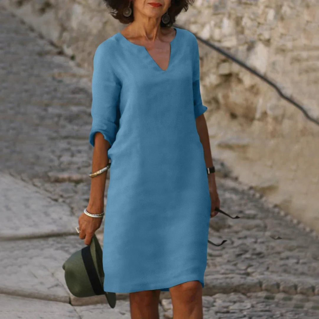 Versatile women's V-neck shift dress, half sleeves, ideal for casual summer everyday fashion.