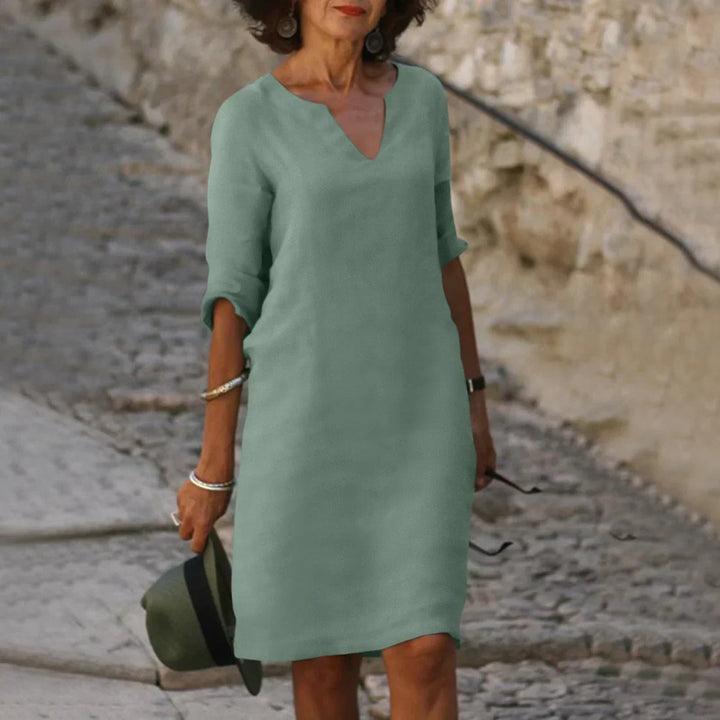 Classic V-neck shift dress for women, half sleeves, knee-length design, comfortable for summer.