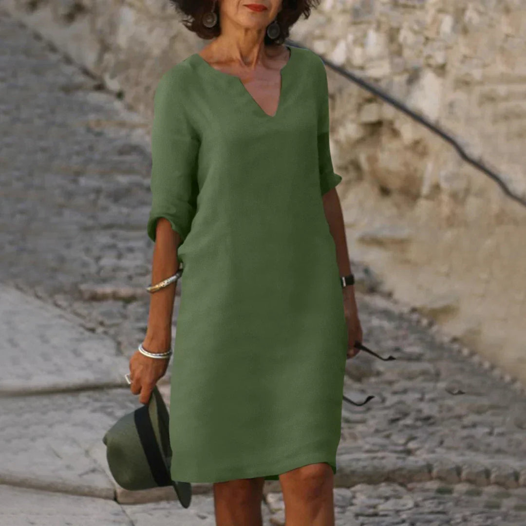 Women's versatile V-neck shift dress with pockets, half sleeves, perfect for casual summer.