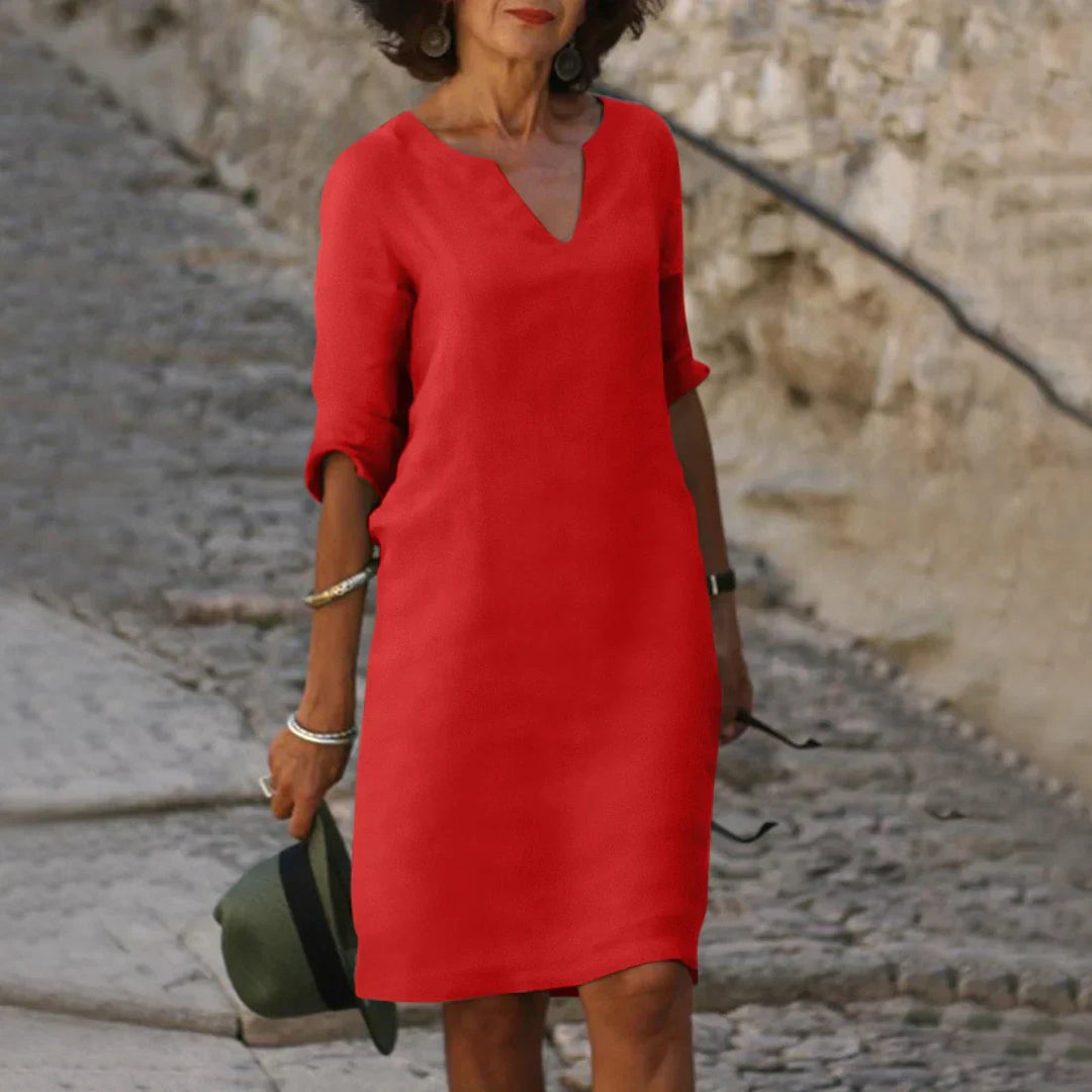 Stylish women's casual V-neck shift dress, knee-length, with half sleeves for summer.