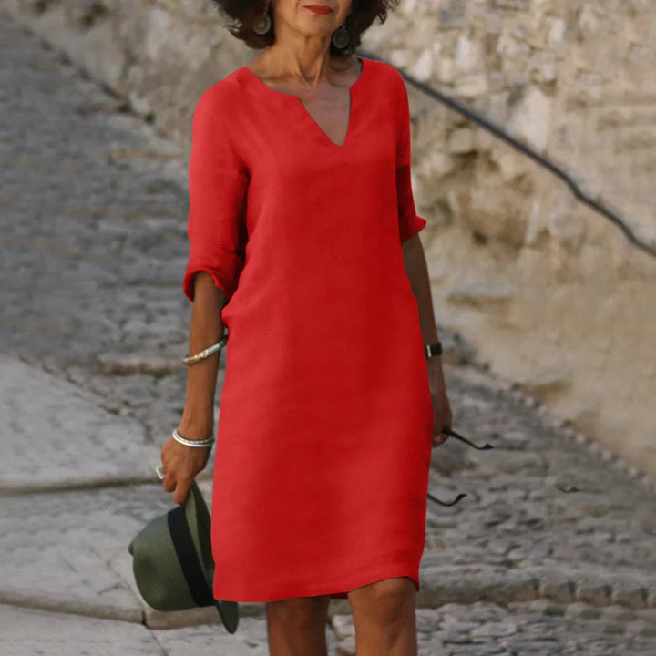 Stylish women's casual V-neck shift dress, knee-length, with half sleeves for summer.