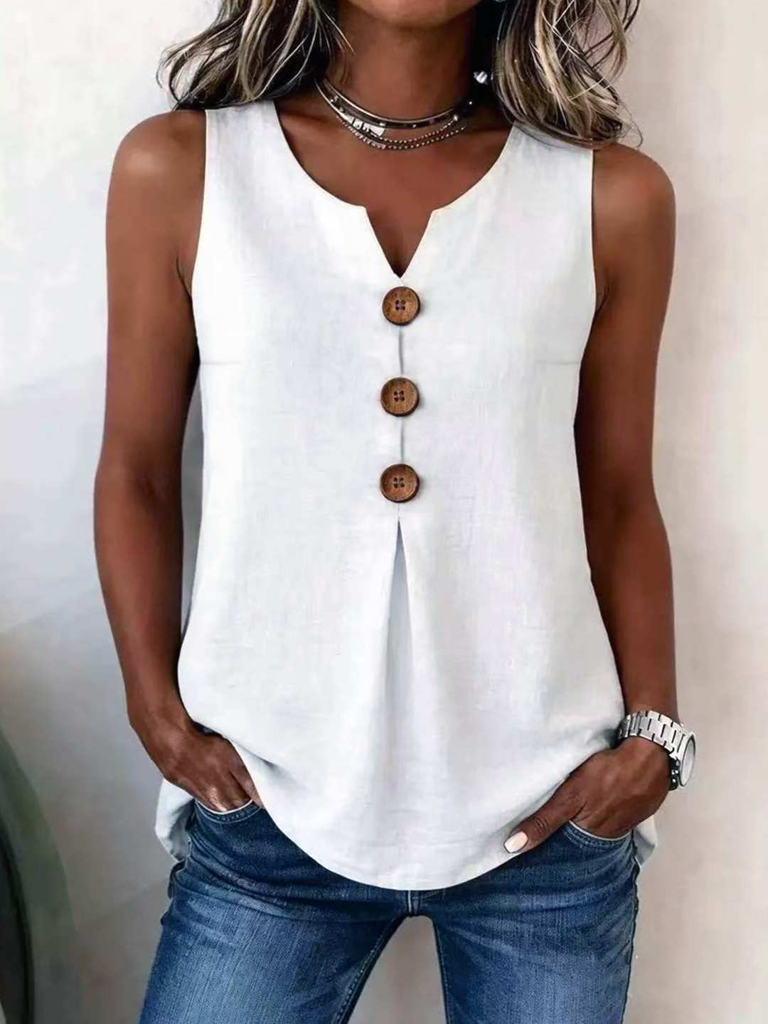 Sleeveless V-neck blouse for women, pleated front with stylish button detail & loose fit. Comfy & chic.
