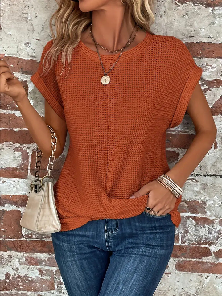 Stylish women's waffle knit short sleeve top, versatile for casual everyday wear, flattering fit.