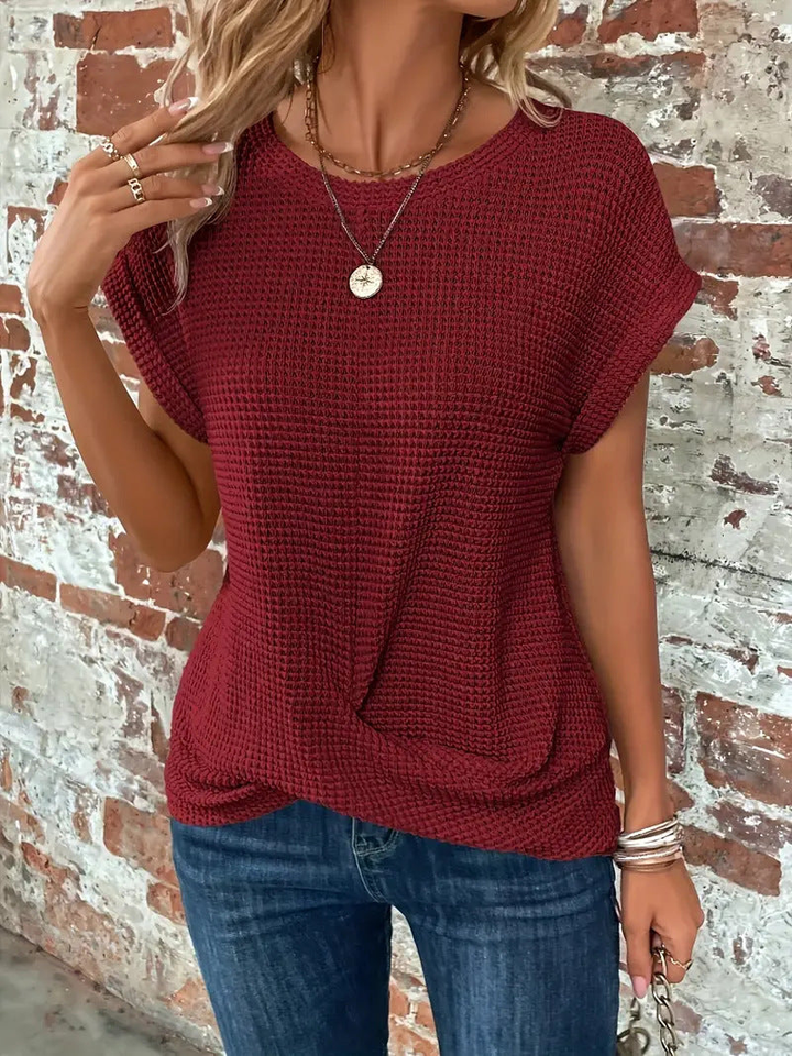 Comfortable women's short sleeve waffle knit top with round neck, perfect for relaxed everyday wear.