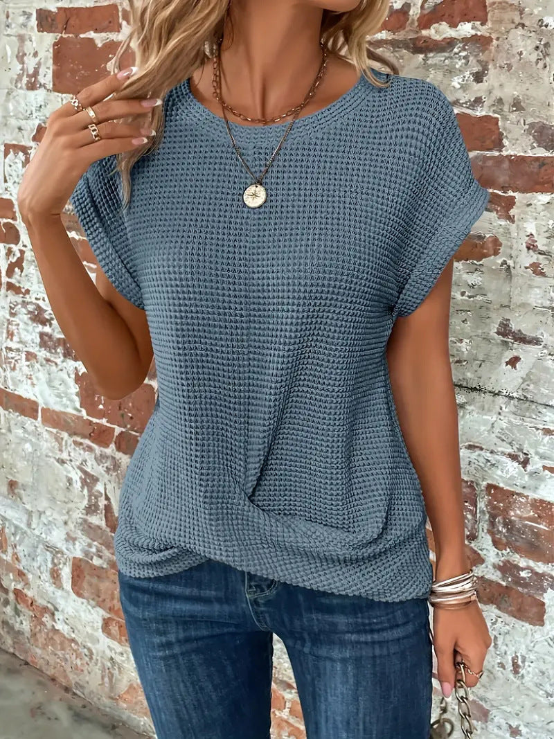 Seasonal women's short sleeve waffle knit top, perfect for casual everyday wear and stylish comfort.
