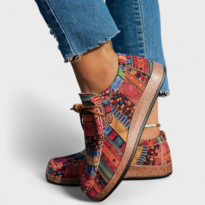 Slip-on women's walking sneakers featuring a stable wide sole & adjustable fit for comfortable daily wear.