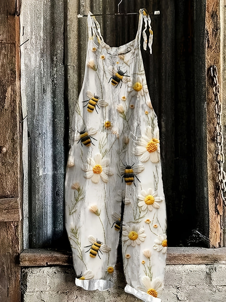 Garden-style women's wide-leg jumpsuit with charming daisy & bee print. Ideal casual summer outfit with pockets.