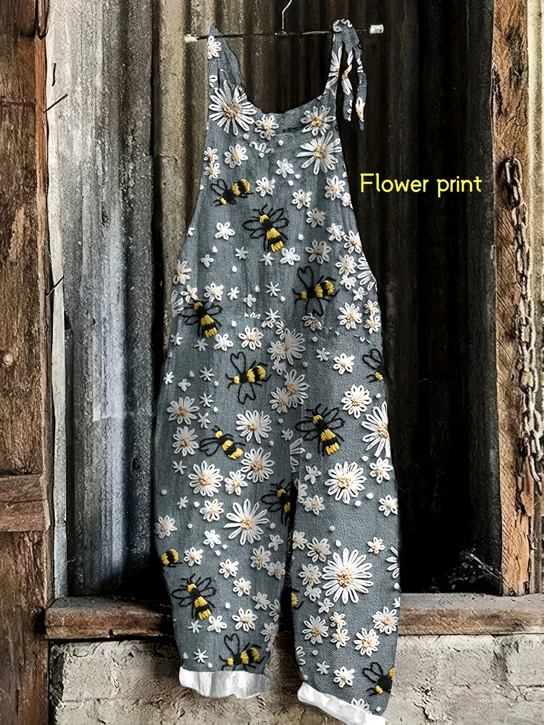 Comfortable women's casual jumpsuit, daisy bee print, wide-leg, tie-shoulder, and practical pockets.