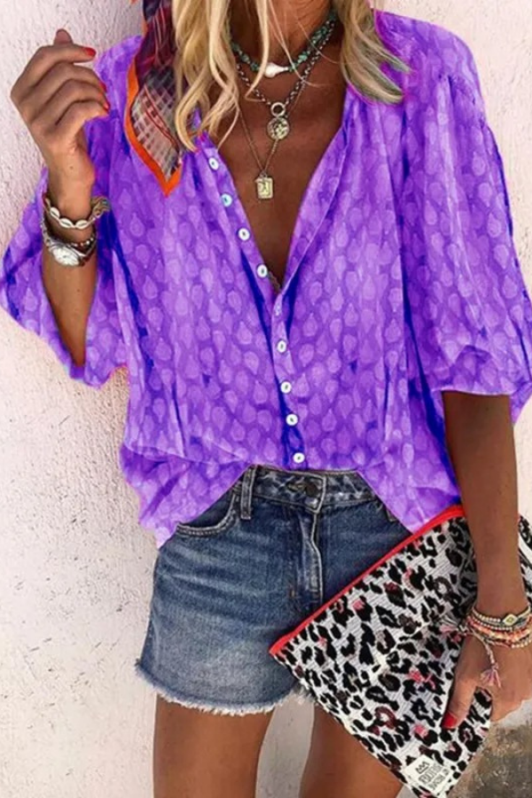 Model wearing a casual chic women's button-down blouse, ideal for everyday wear and summer style.