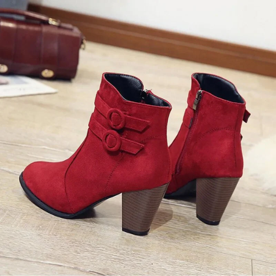 Women's chic black leather ankle boots with decorative buckle and functional side zipper closure