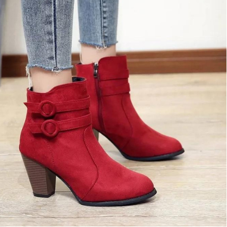 Versatile black ankle boots for women, showcasing a modern chic design with buckle and zip detail