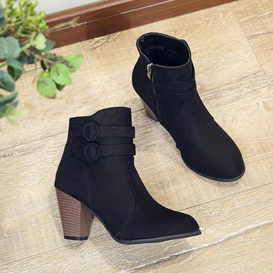 Fashionable women's winter ankle boots, black, with elegant buckle accent and convenient zip opening