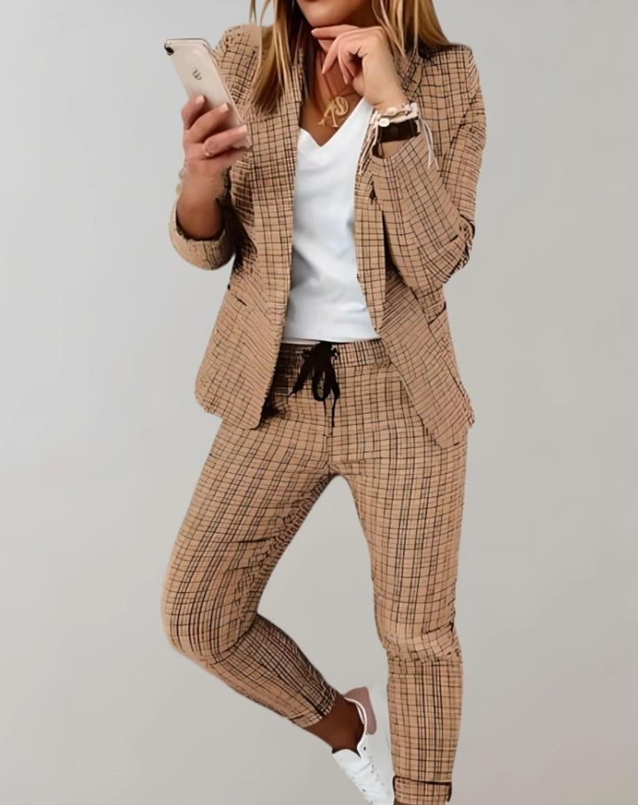Beautiful women's spring fashion set featuring a stylish blazer and comfortable matching trousers.