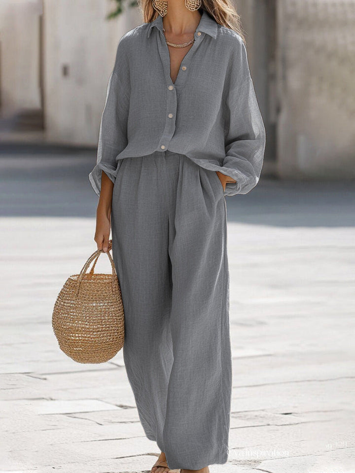 Elegant women's two-piece outfit: chic blouse & coordinating pants. Ideal for vacation.