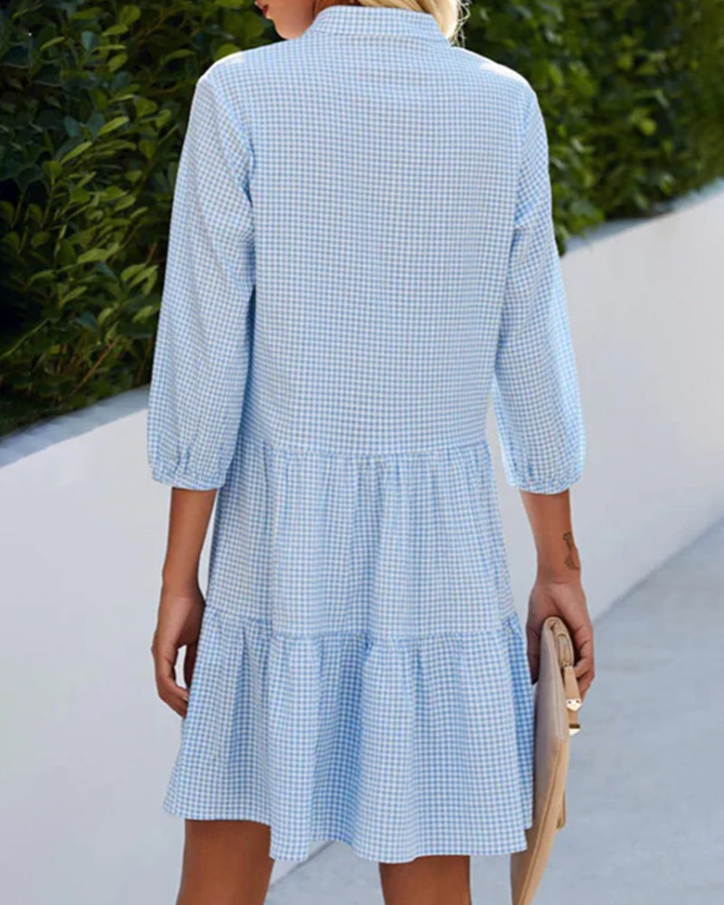 Casual women's short sleeve blue checkered summer dress, midi length, button front, chic and comfortable.