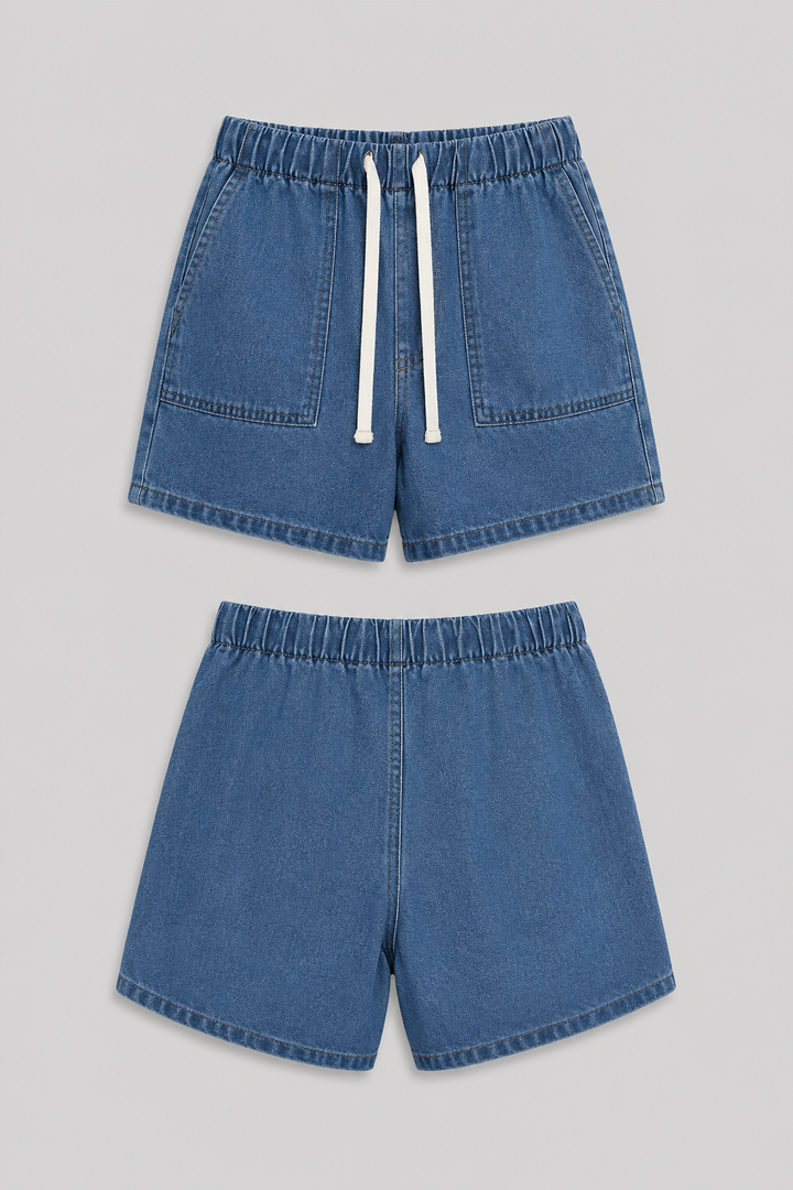 Woman wearing a stylish blue denim short set, featuring a jacket & shorts, perfect for summer fashion.