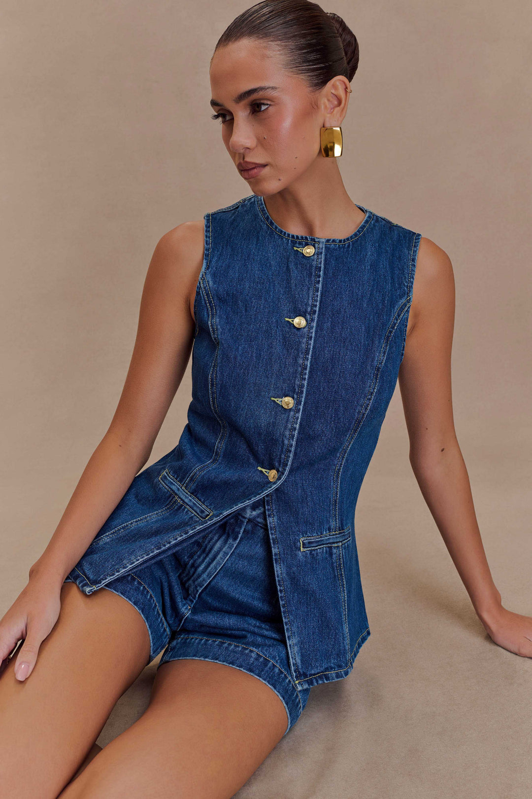 Trendy women's denim two-piece set in blue, offering chic style & comfort for a relaxed casual look.