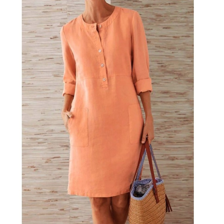 Relaxed fit women's tunic shift dress with button front and side pockets, ideal for a comfortable everyday look.
