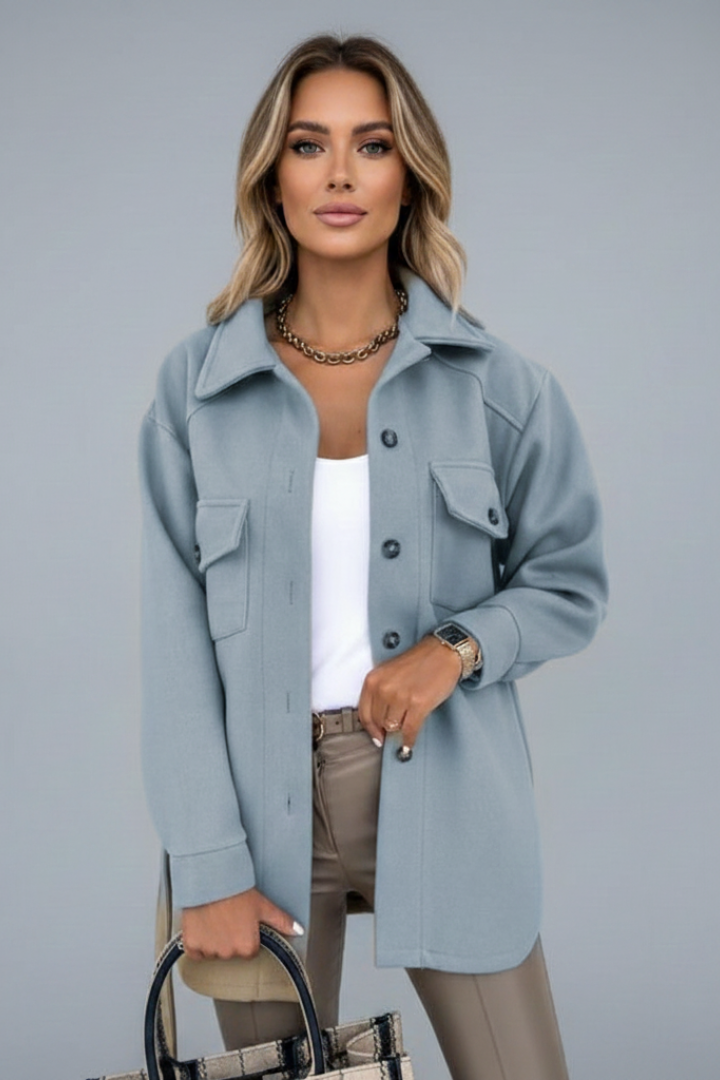 Woman modelling a versatile straight cut collared shirt jacket. Casual chic, elegant layering.