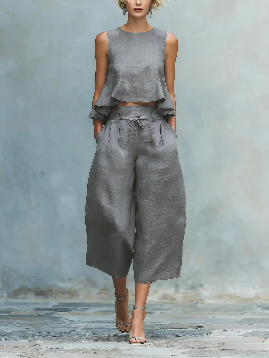 Chic women's pant set with a trendy crop top and elegant wide leg pants. A fashionable two-piece summer ensemble.
