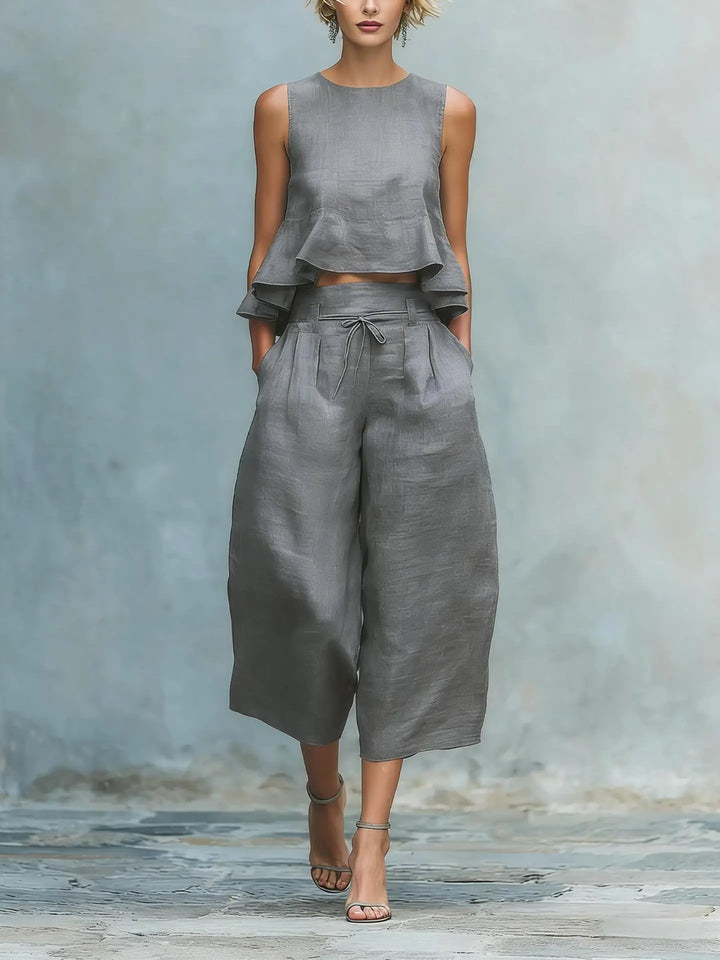 Chic women's pant set with a trendy crop top and elegant wide leg pants. A fashionable two-piece summer ensemble.