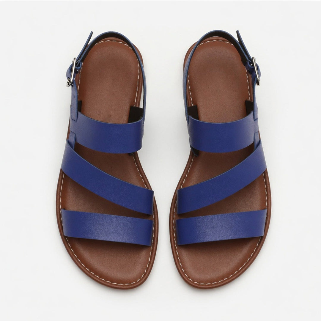 Spring/Summer women's flat sandals, open-toe, crossover strap, effortless style.