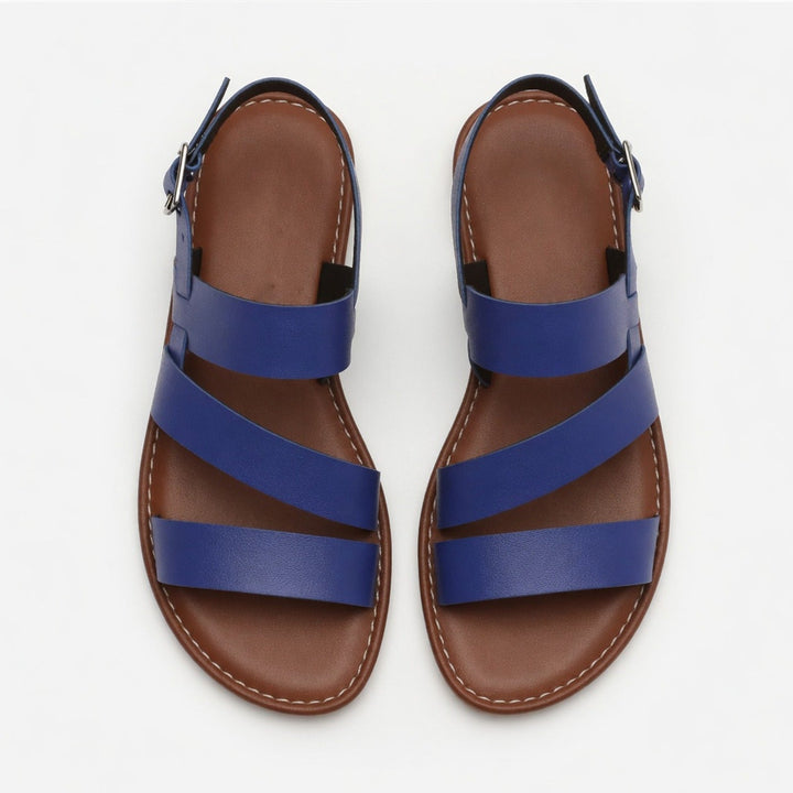 Spring/Summer women's flat sandals, open-toe, crossover strap, effortless style.