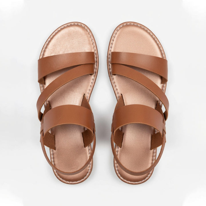 Casual women's flat sandals featuring chic crossover straps for spring/summer.