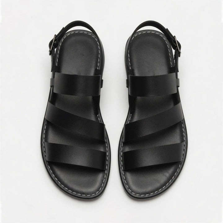 Vacation-ready women's flat sandals, chic crossover straps, comfortable and casual.