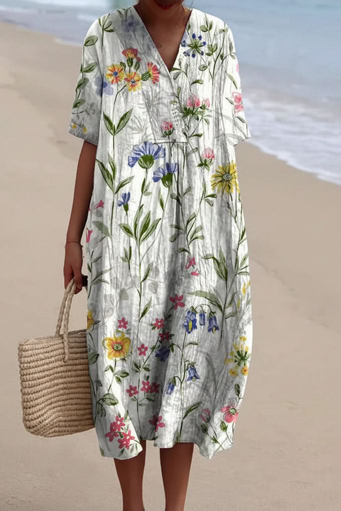 Vibrant floral pattern women's midi dress featuring a chic V-neck, designed for breezy summer fashion.